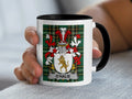 Mug with O'HALIE crest on plaid background.