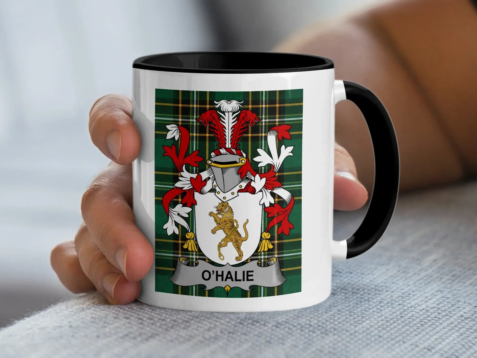 Mug with O'HALIE crest on plaid background.