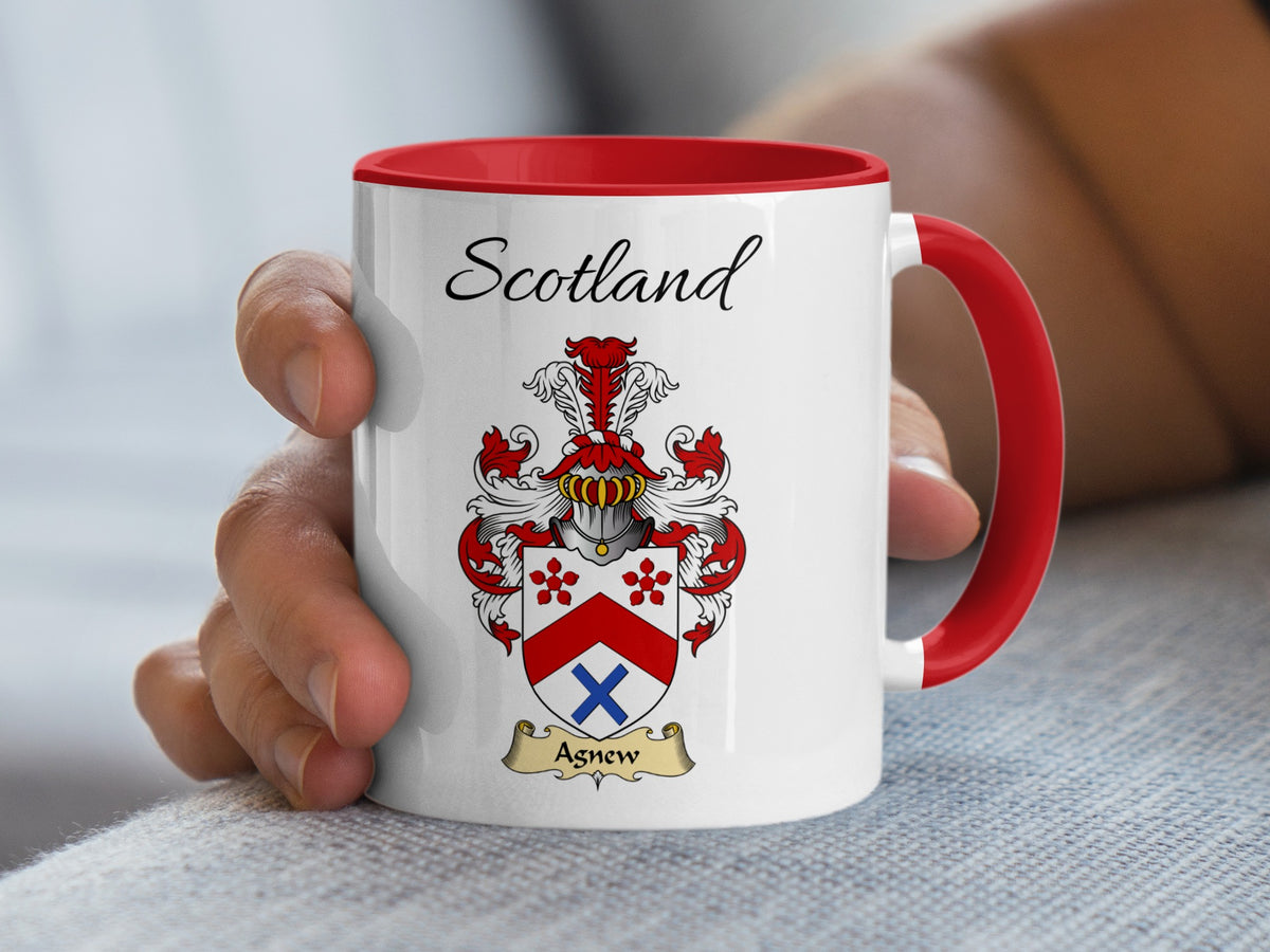 Red-accent Agnew Scottish surname mug with matching handle and interior and coat of arms artwork beneath “Scotland”.