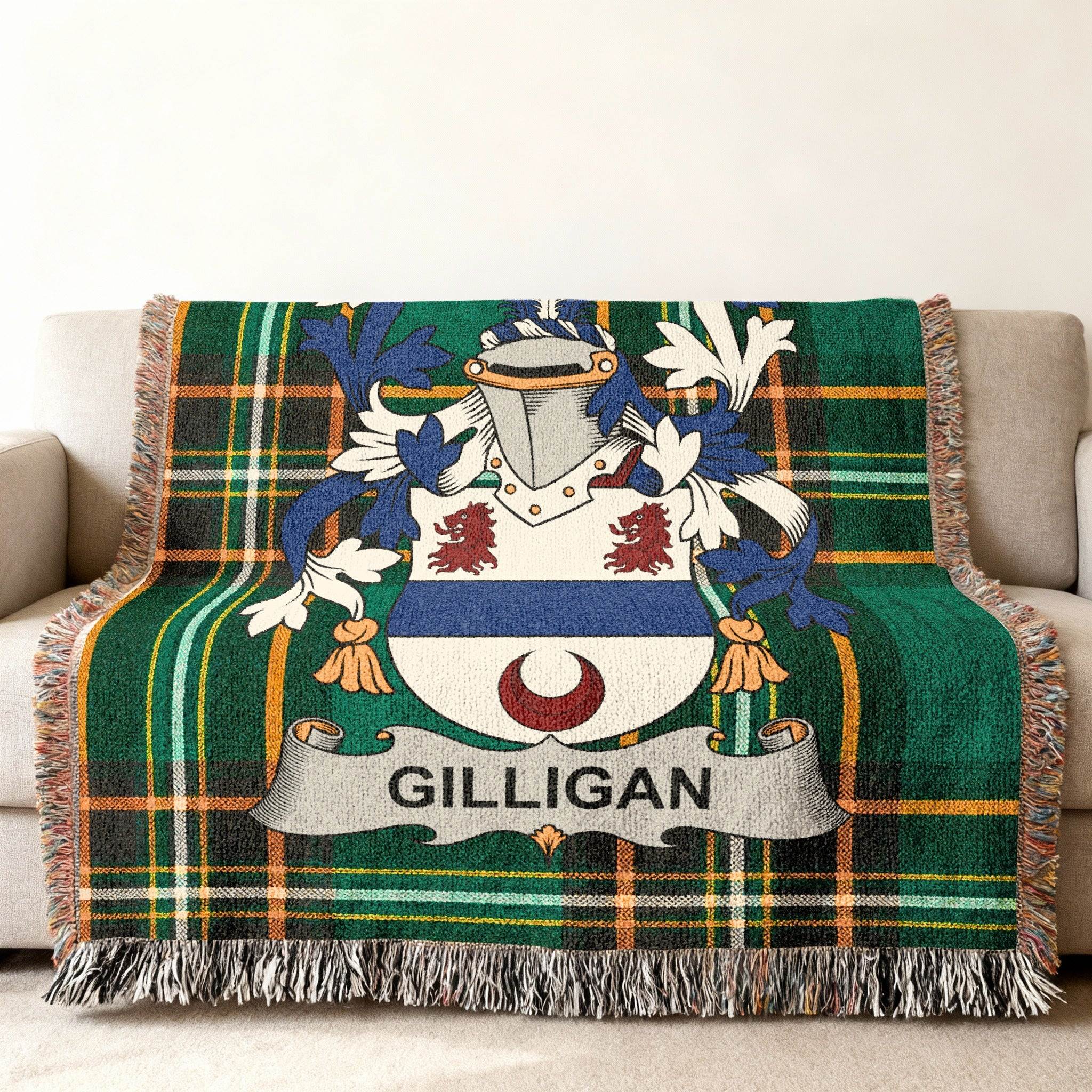 Green tartan blanket with Gilligan family crest centered.