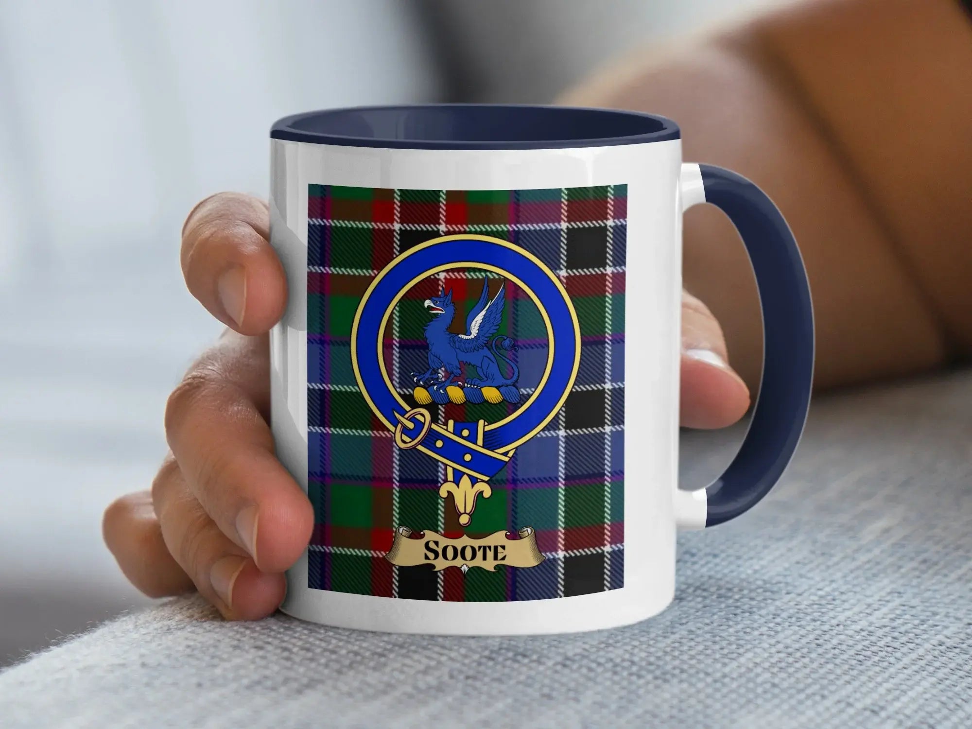 Soote family crest coffee mug with a tartan-background design