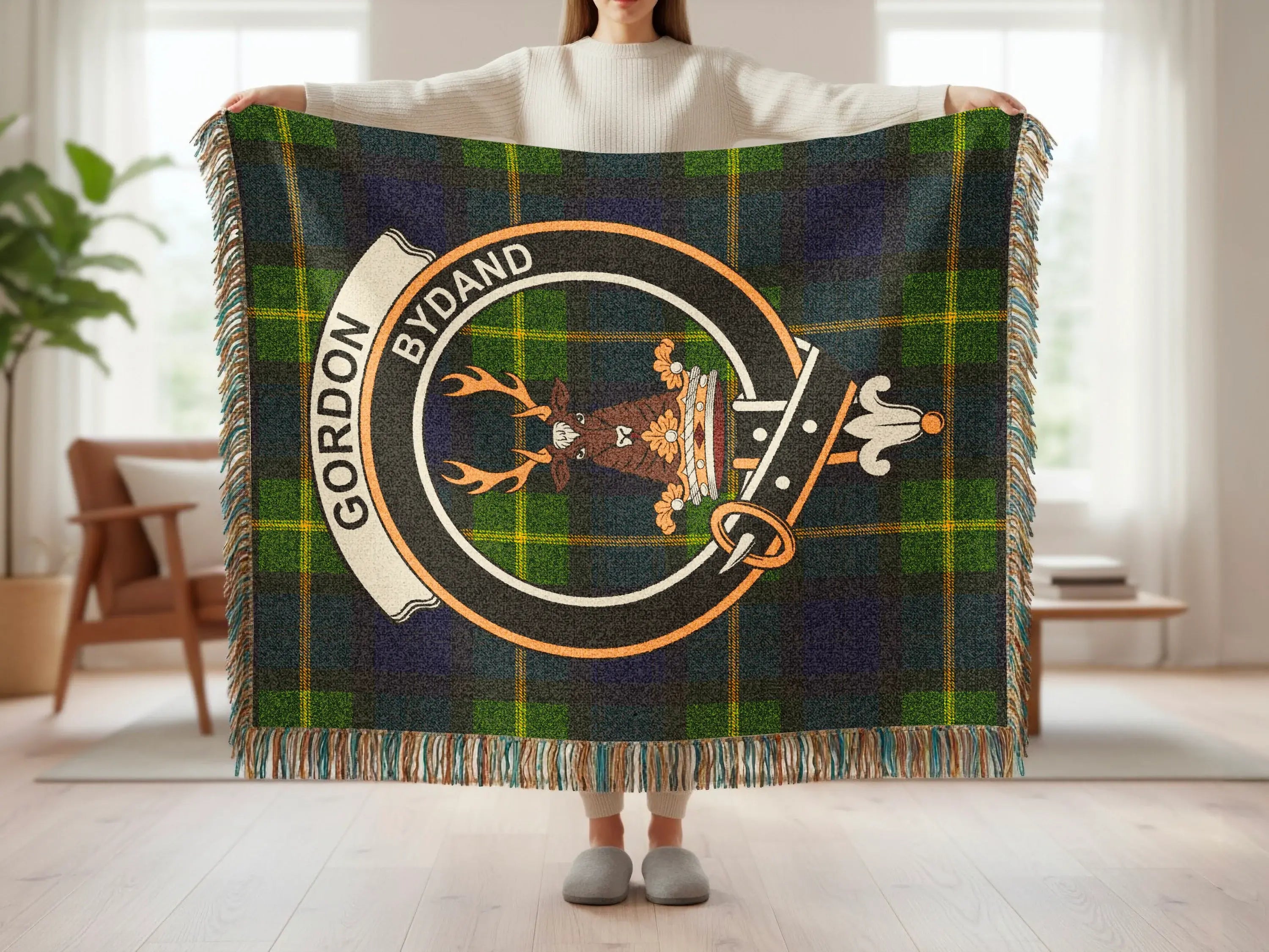Gordon clan tartan woven blanket showing crest detail and fringe edge — heirloom quality cotton