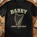 Barry Irish harp T-shirt in Black, with cream surname lettering, a gold-toned harp, green shamrock and “Irish Heritage” text.