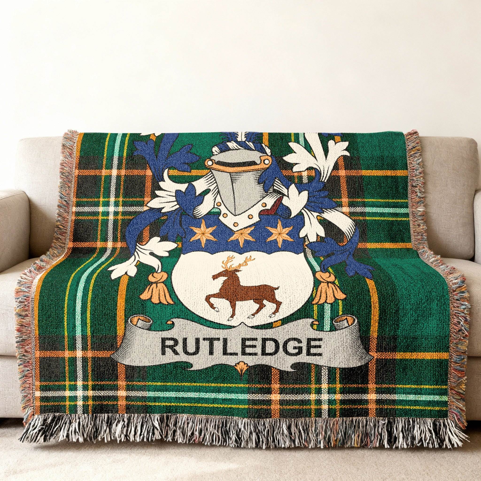 Rutledge tartan blanket with a family crest featuring a deer.