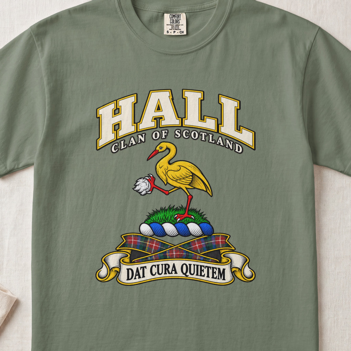 Hall Scottish clan T-shirt in Moss, front view with a golden crane holding a white stone and motto banner.