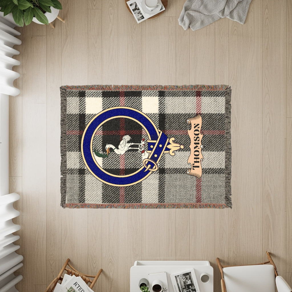 Tapestry with plaid pattern, Thomson crest, and banner.