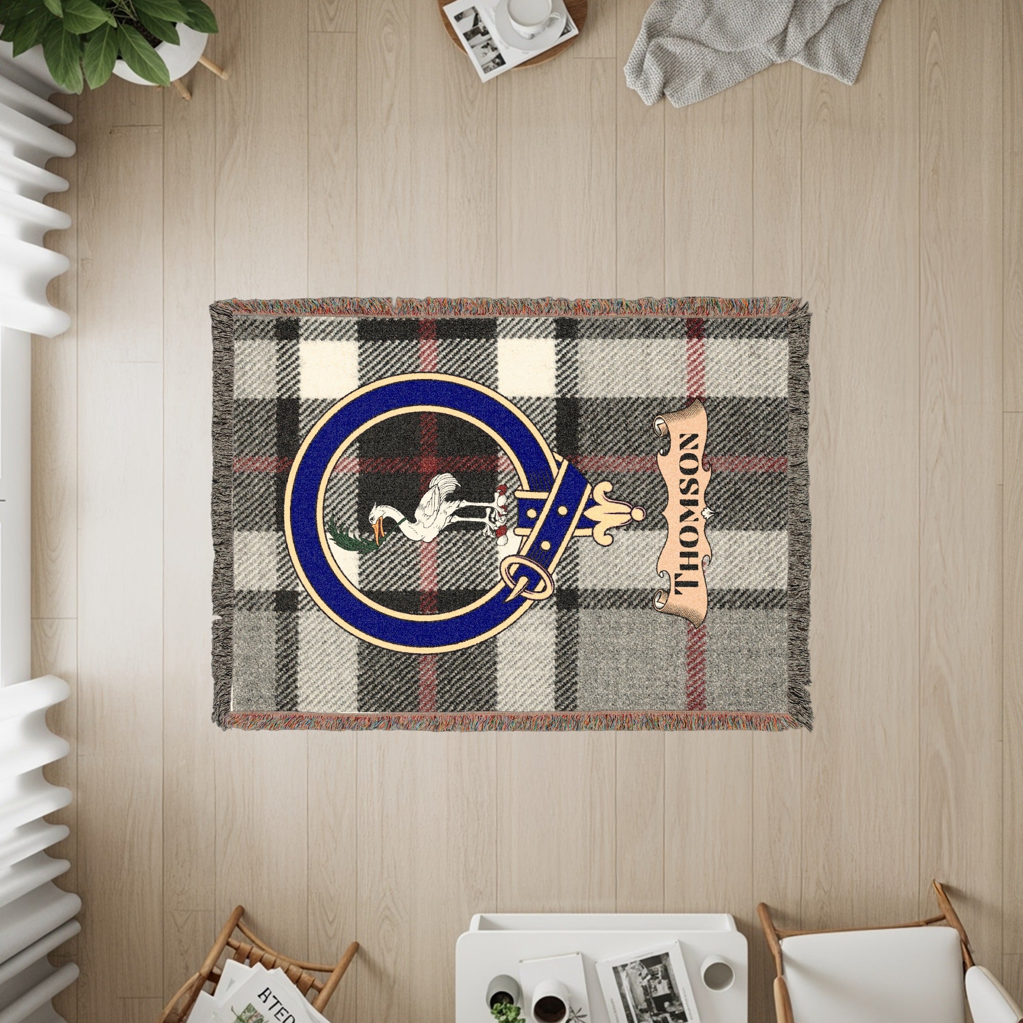 Tapestry with plaid pattern, Thomson crest, and banner.