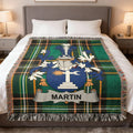 Tartan blanket with the surname MARTIN on a crest.