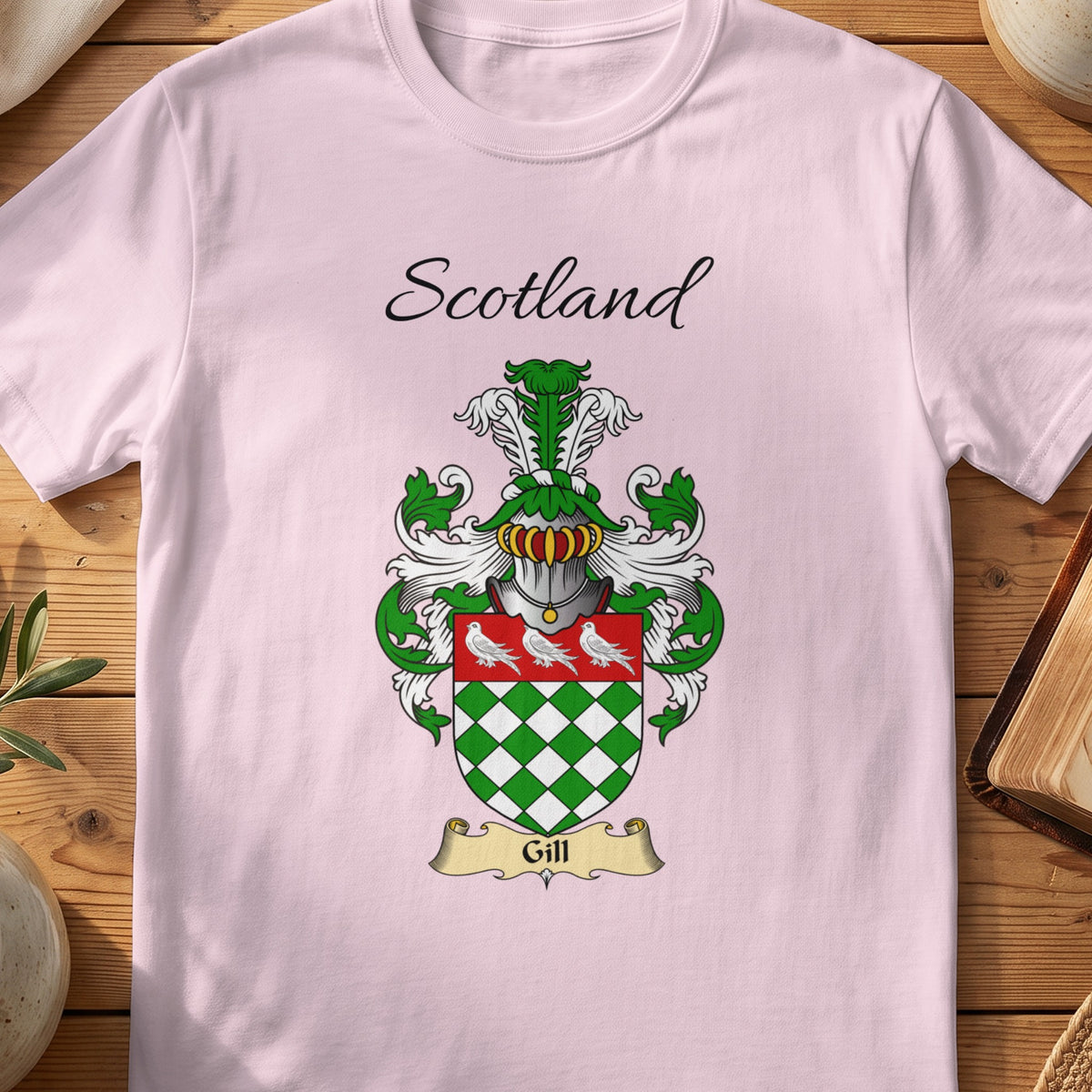 Light Pink Gill Scottish family shield T-shirt featuring green-and-white diamonds beneath white birds