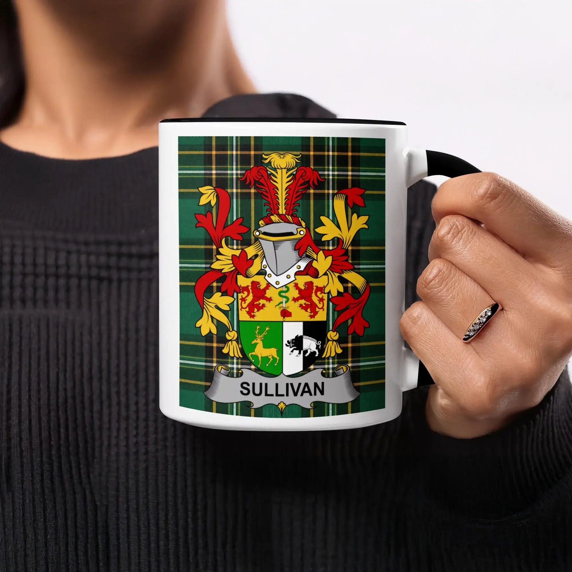 Mug with a green, red, and yellow plaid background featuring a family crest with the name "SULLIVAN".