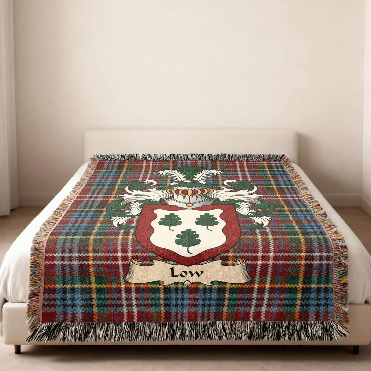 Low Scottish family shield woven blanket on a Caledonia tartan background