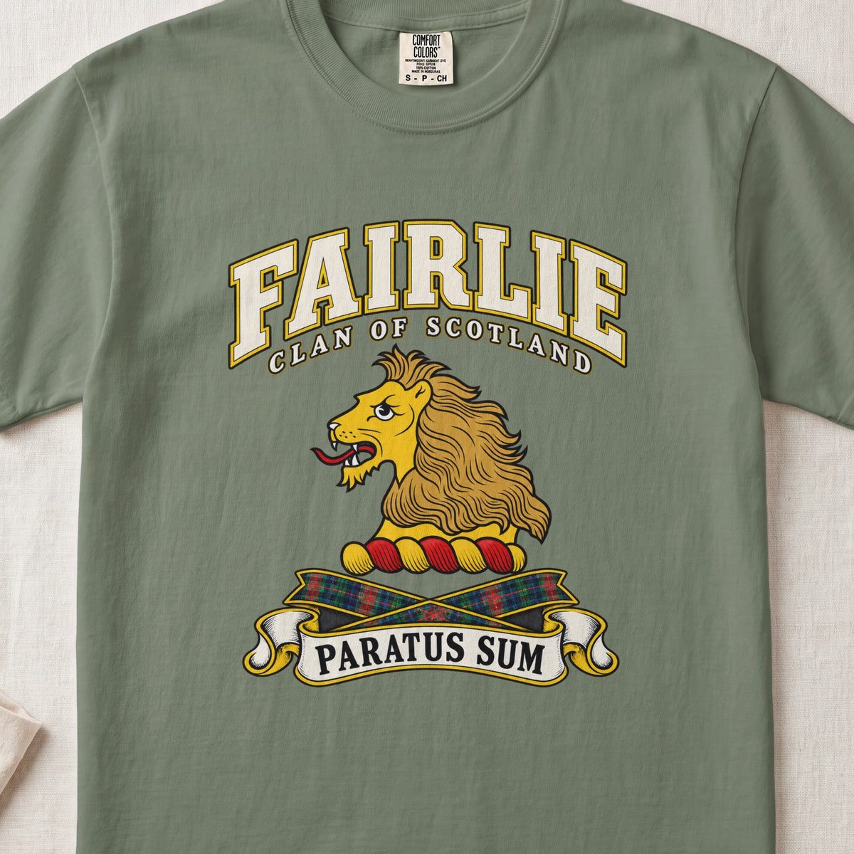 Fairlie Scottish clan T-shirt in Moss, front view with a gold lion head and motto design.