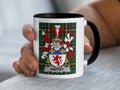 White mug with black rim displaying a coat of arms and the name HAFFEY.
