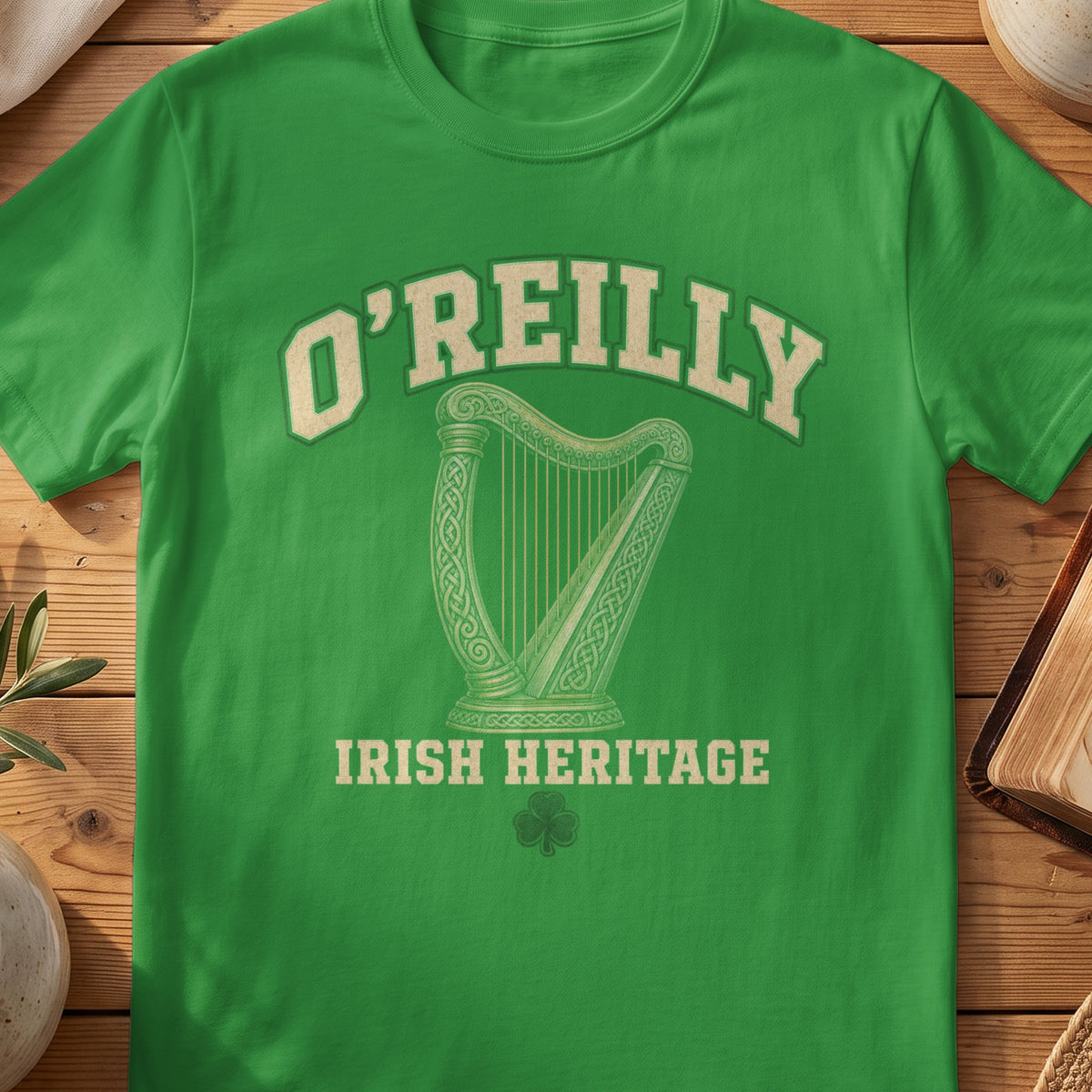 O'Reilly Irish harp T-shirt in Irish Green, with cream surname lettering, a gold-toned harp, green shamrock and “Irish Heritage” text.