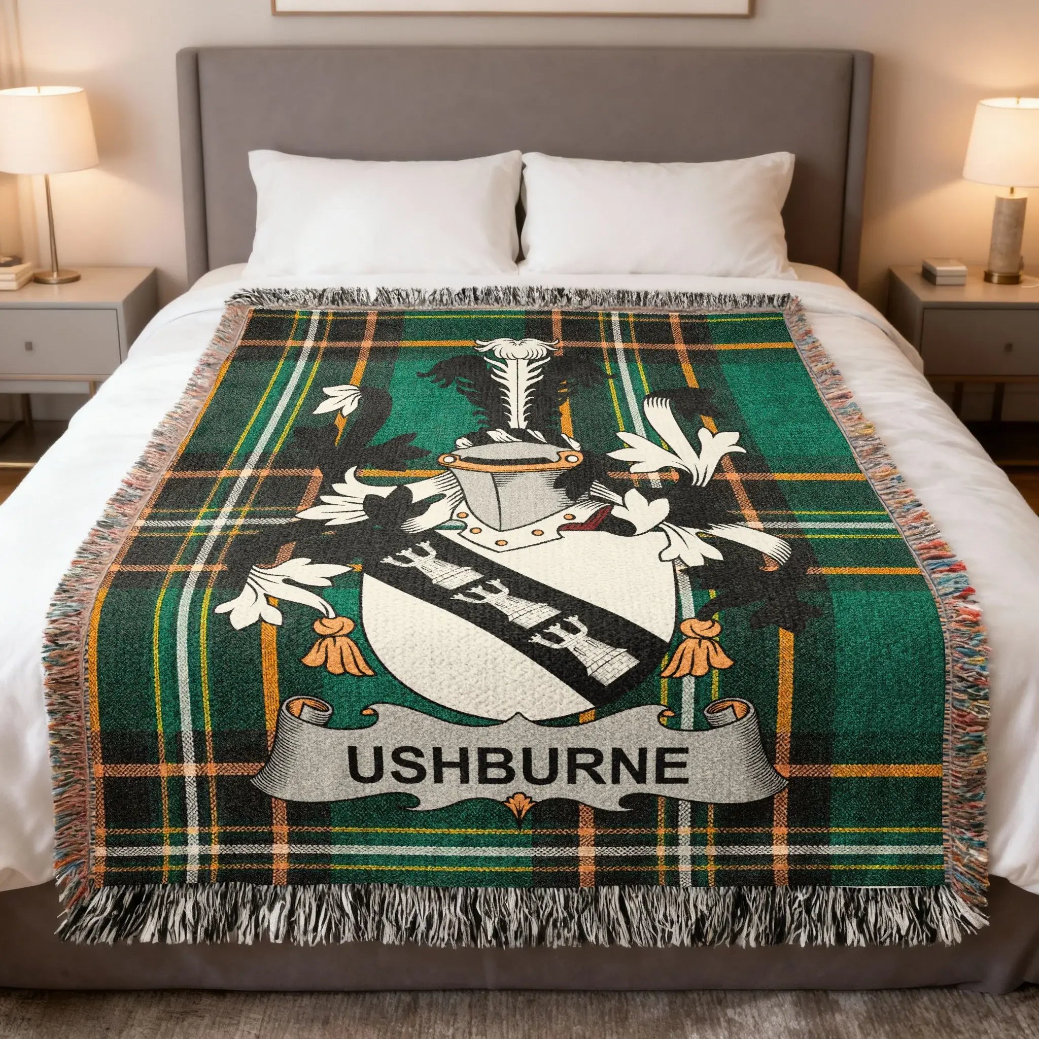 Plaid blanket with Ushburne family crest draped on a bed.