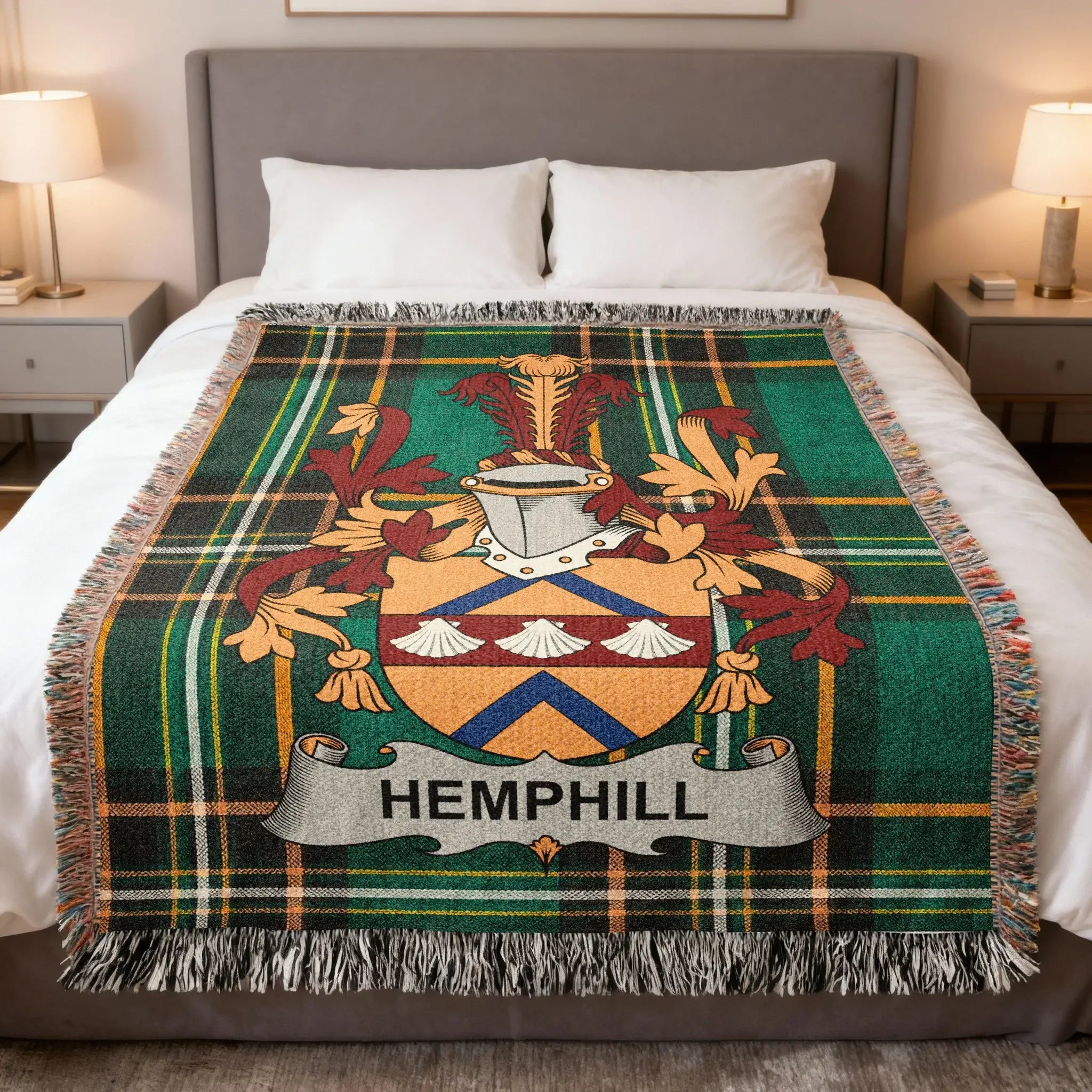 Hemphill family crest on a green plaid throw blanket on a bed.