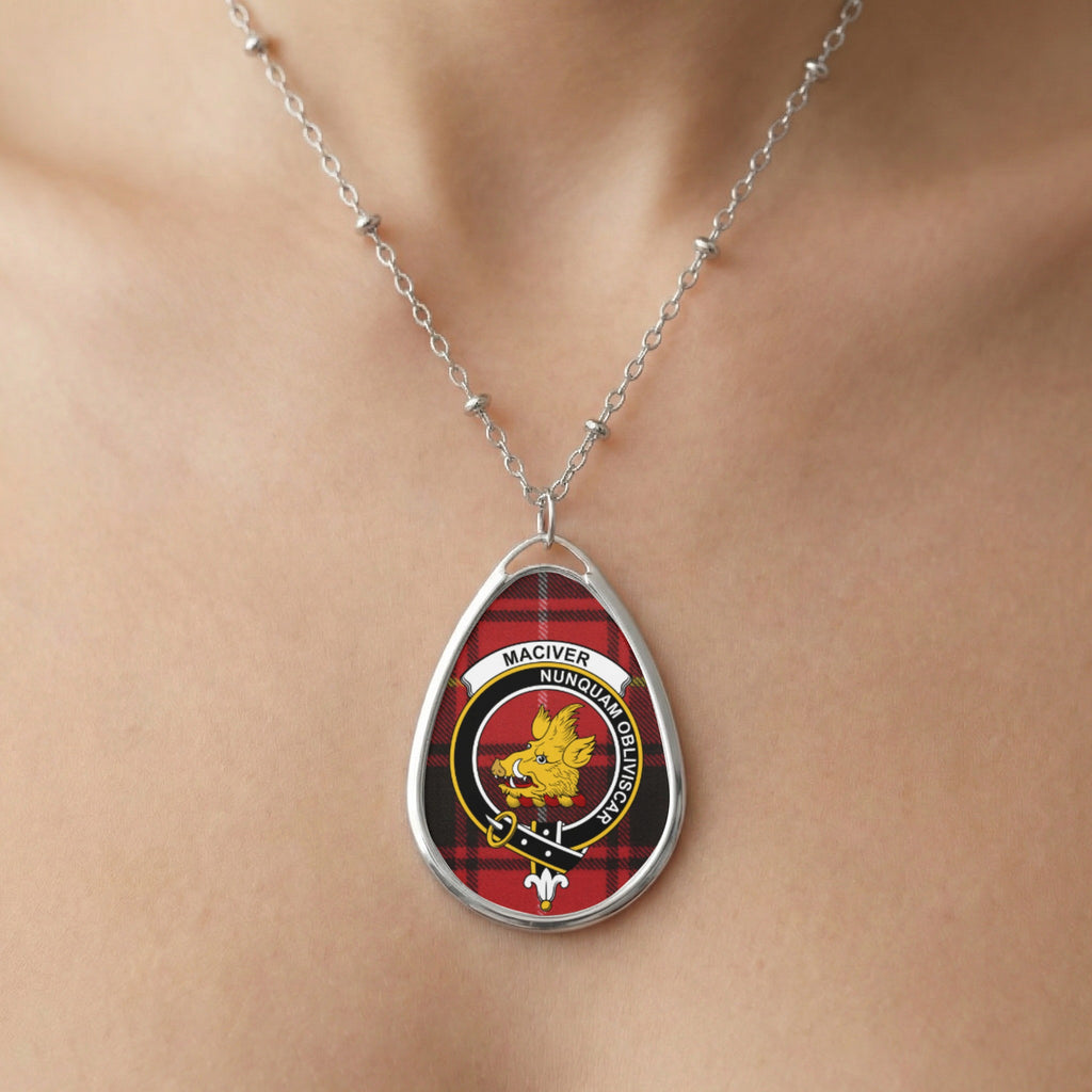 Oval pendant necklace featuring Maciver clan crest on red tartan background.