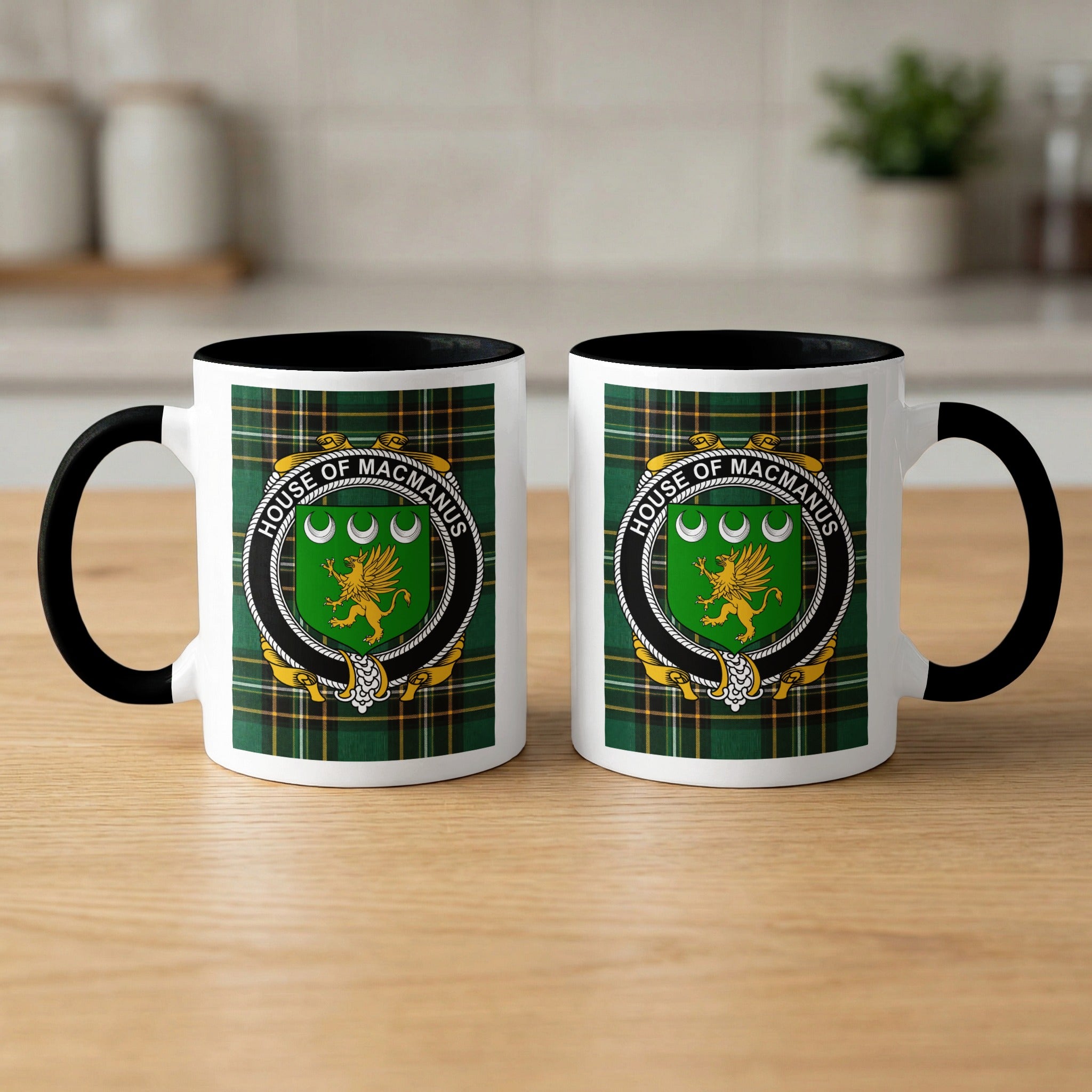 McManus family crest emblem mug with black handle and interior