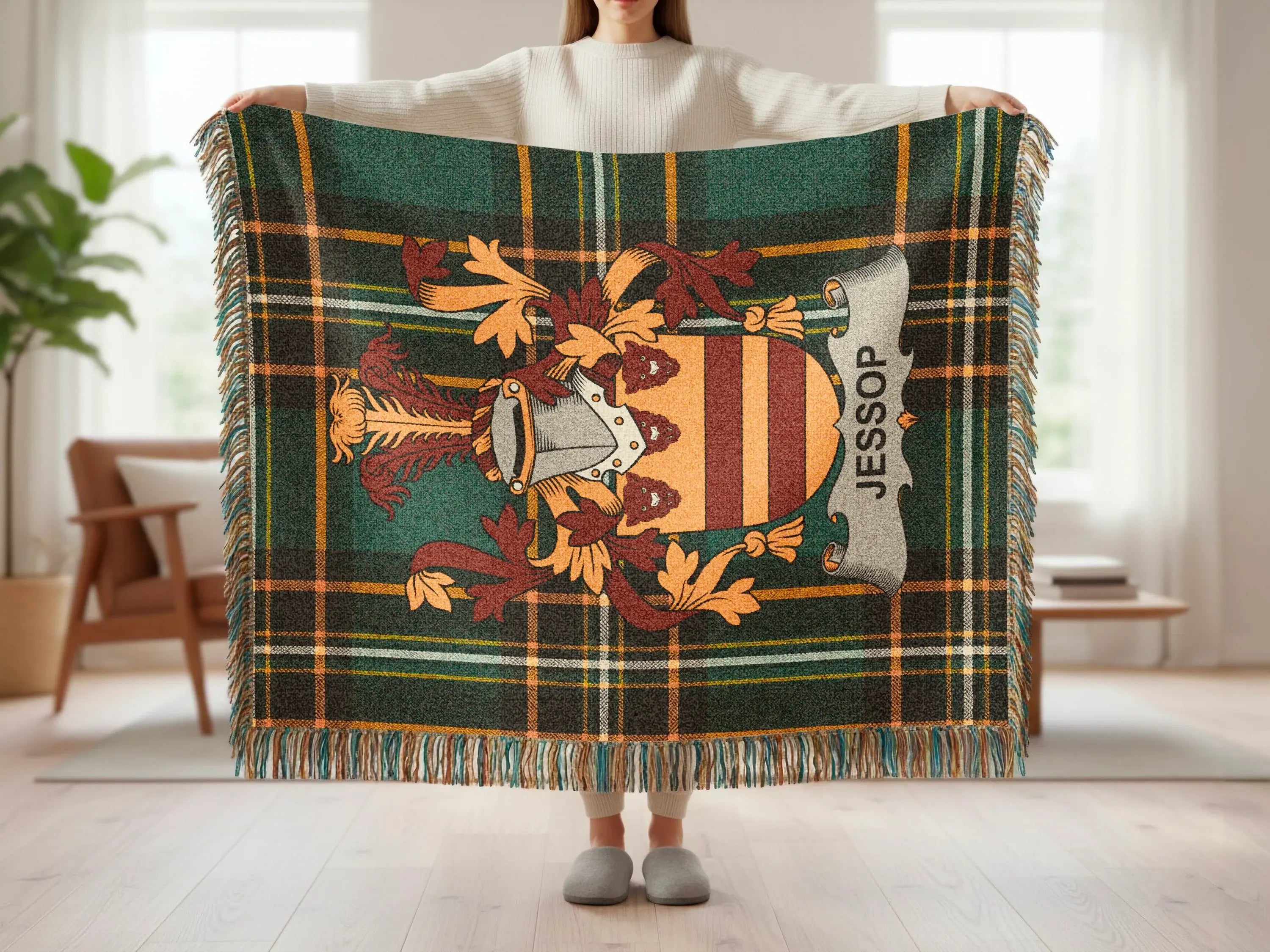 Fringed tartan blanket with the Jessop family crest.