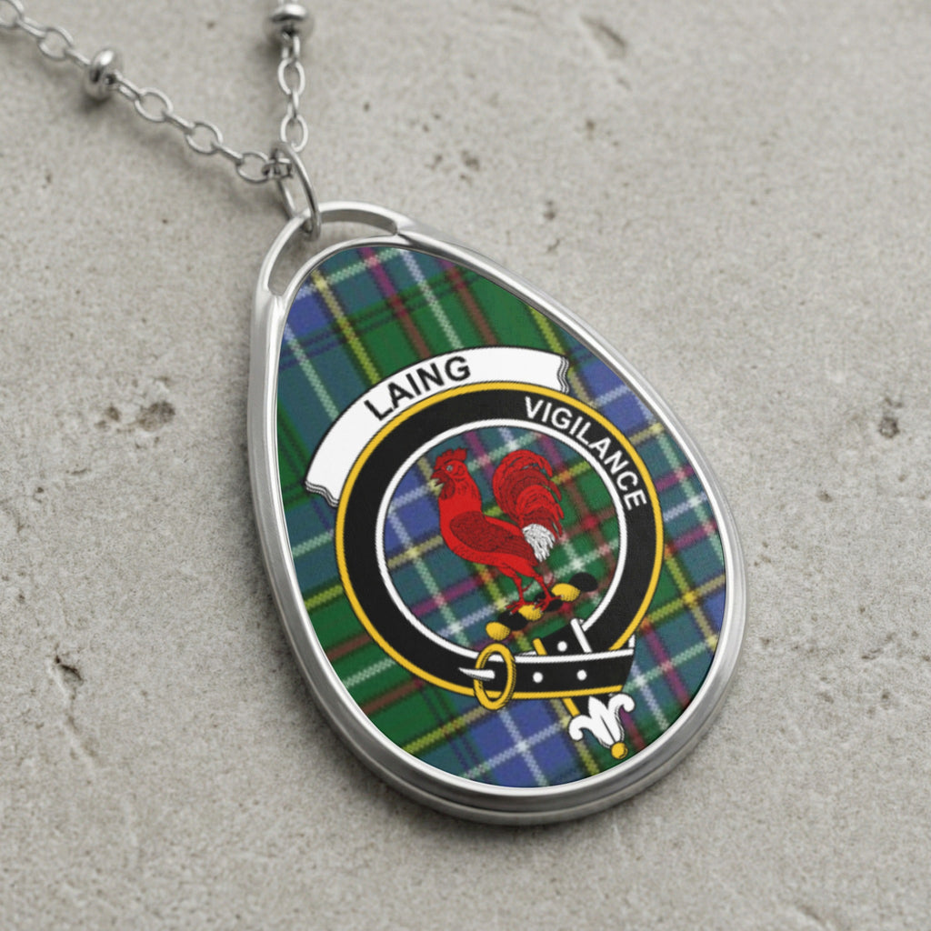 Laing clan Scottish tartan necklace with clan crest on tartan background
