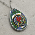 Laing clan Scottish tartan necklace with clan crest on tartan background