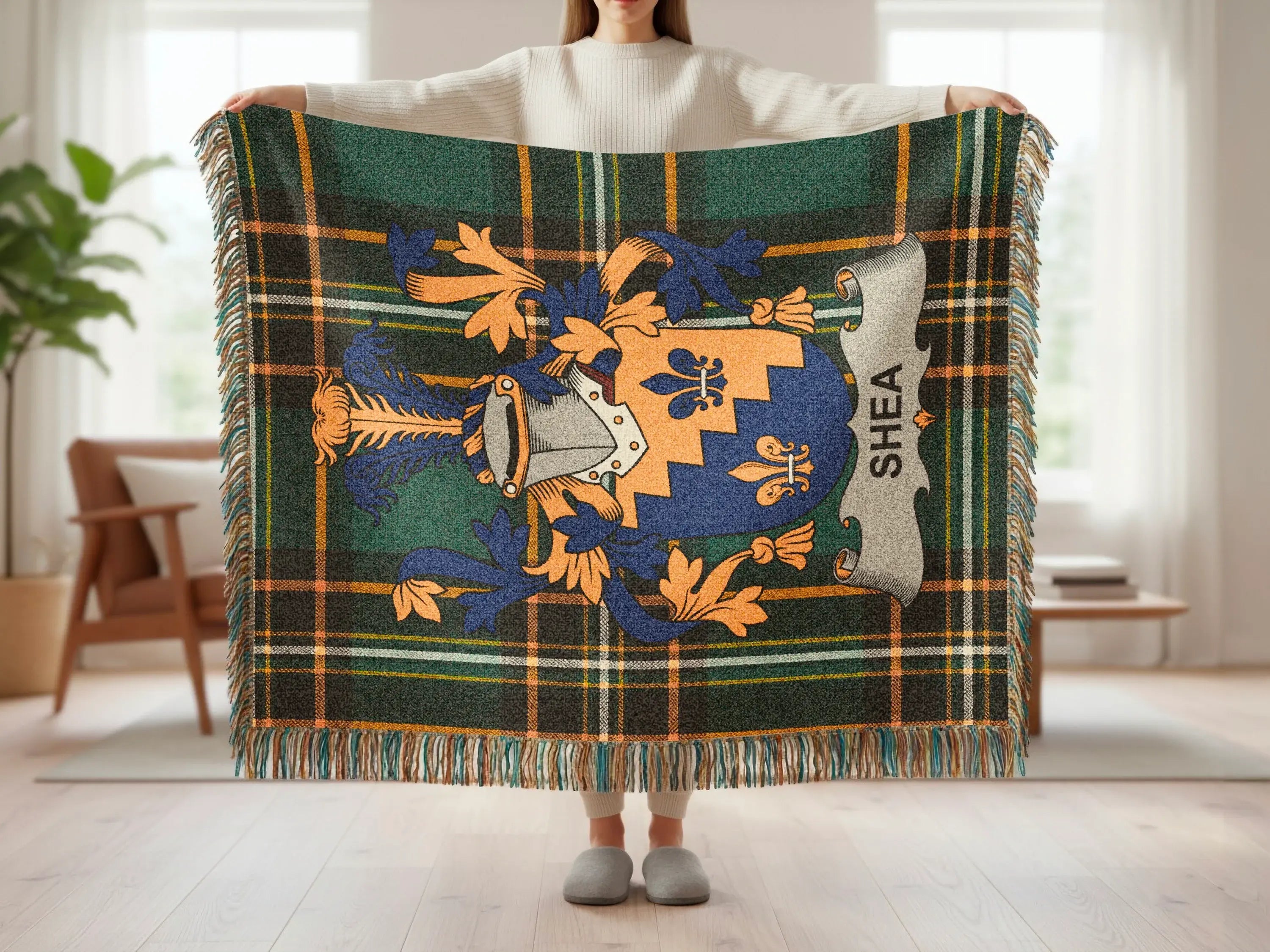 Tartan throw blanket with Shea family crest and fringe.