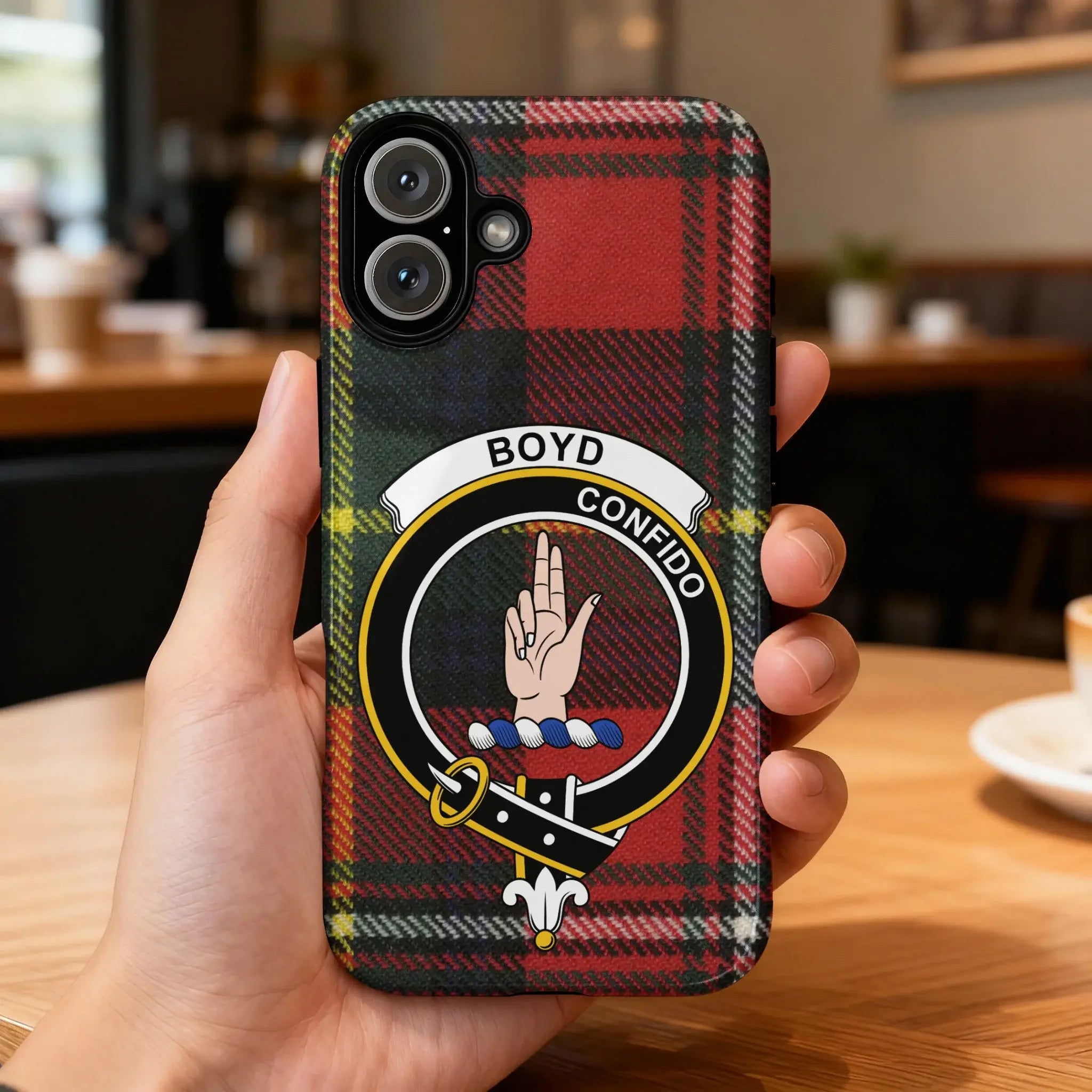 Boyd clan crest tartan phone case on iPhone — edge-to-edge red and green Confido design