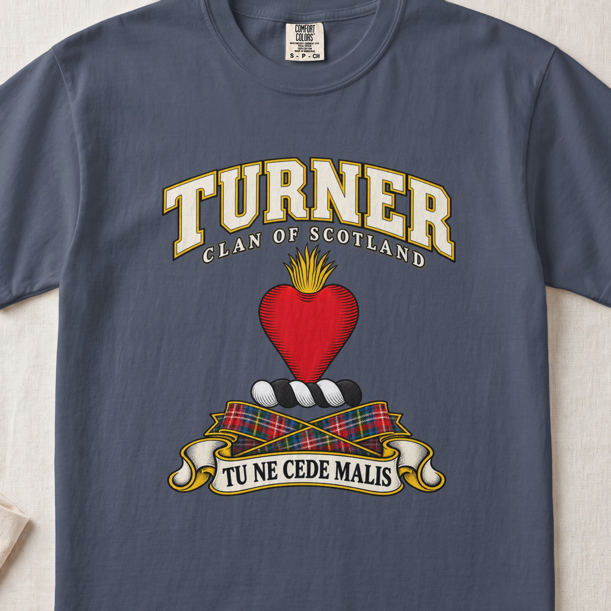 Turner Scottish clan T-shirt in Midnight, front view with a red heart topped with golden flames and motto banner.