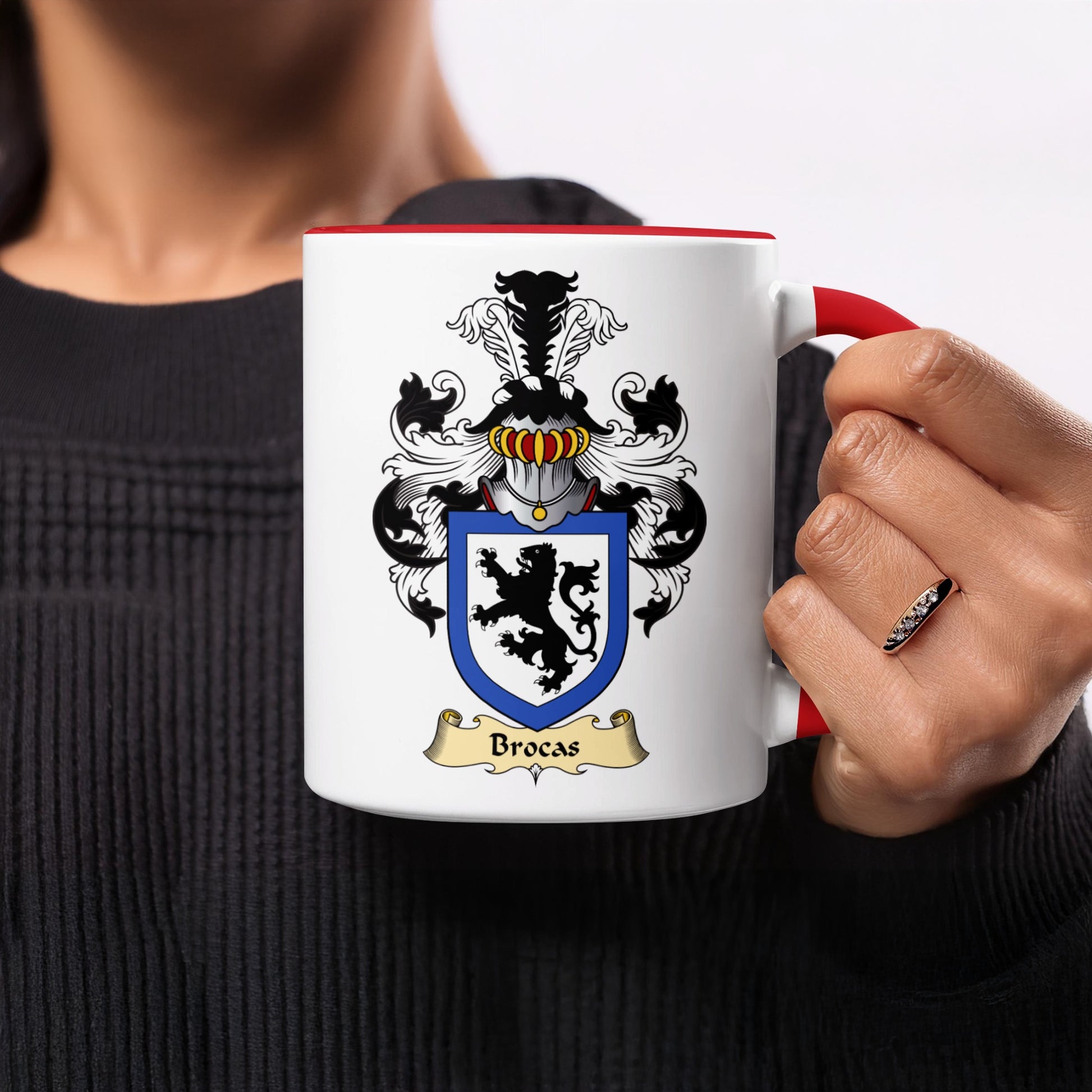 White mug with red rim featuring the Brocas coat of arms.