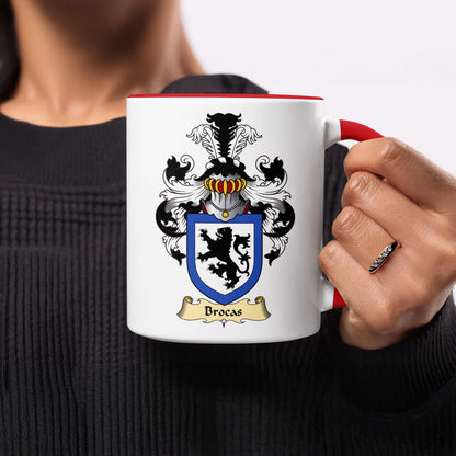 White mug with red rim featuring the Brocas coat of arms.