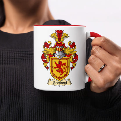 White mug with red handle featuring the Scottish coat of arms and "Scotland" banner.