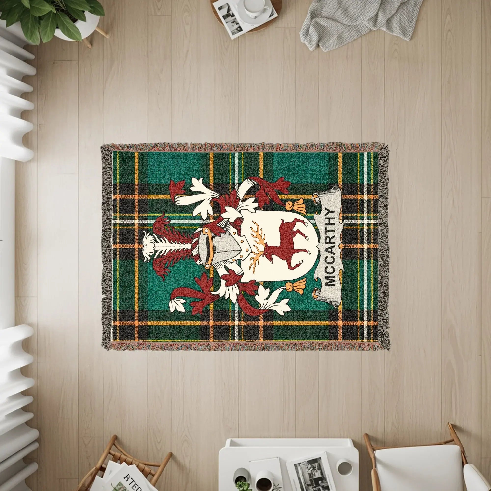 Green tartan blanket with McCarthy family crest and name.