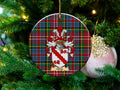 Gleis Scottish clan ceramic ornament with family crest on a Caledonia tartan background, hanging on a Christmas tree