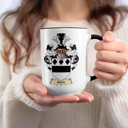 White mug with black rim featuring Aston family crest.