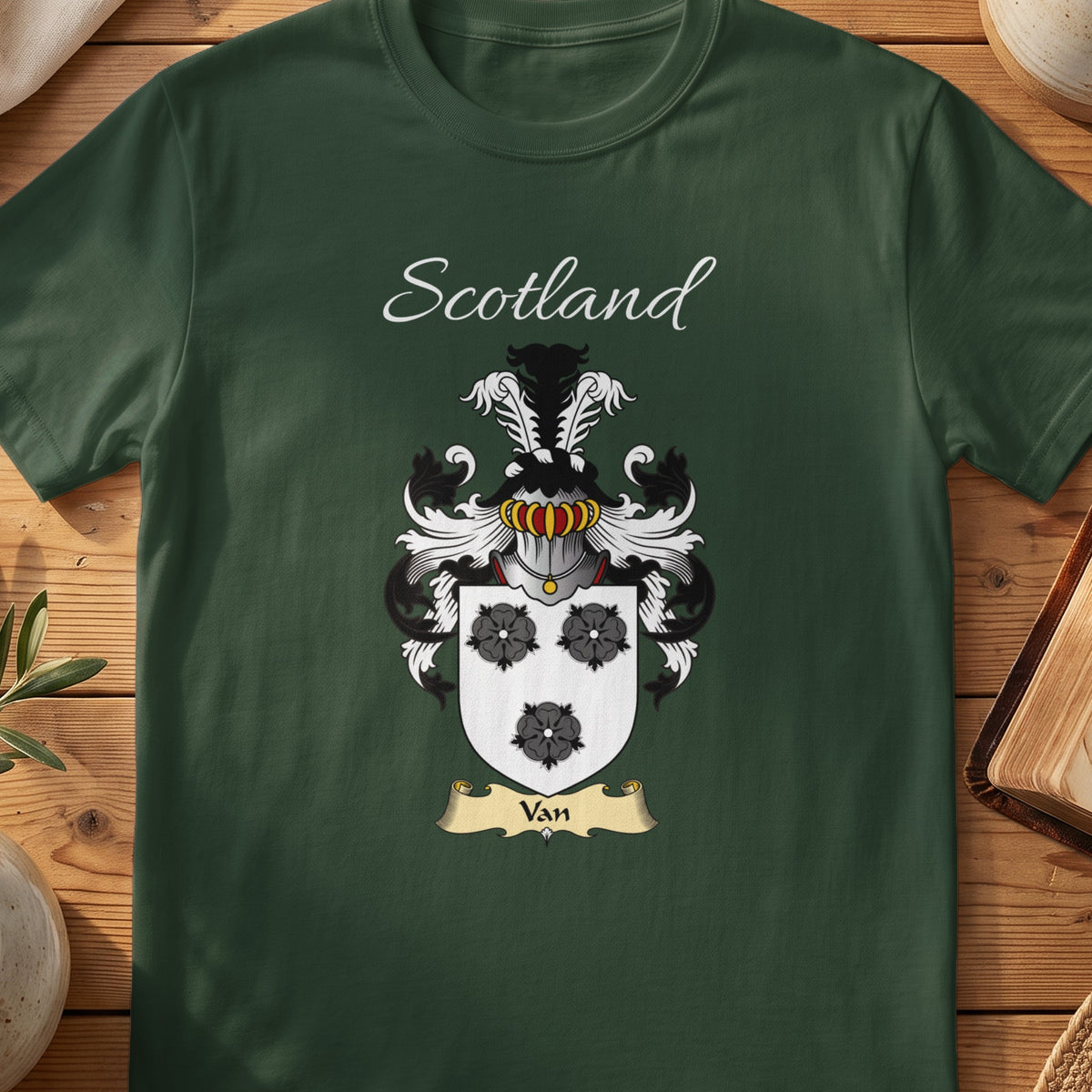 Forest Green Van Scottish T-shirt laid flat with coat of arms artwork and “Scotland” text.