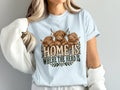 Model wearing the Home Is Where the Herd Is Highland cow Comfort Colors T-shirt in Chambray