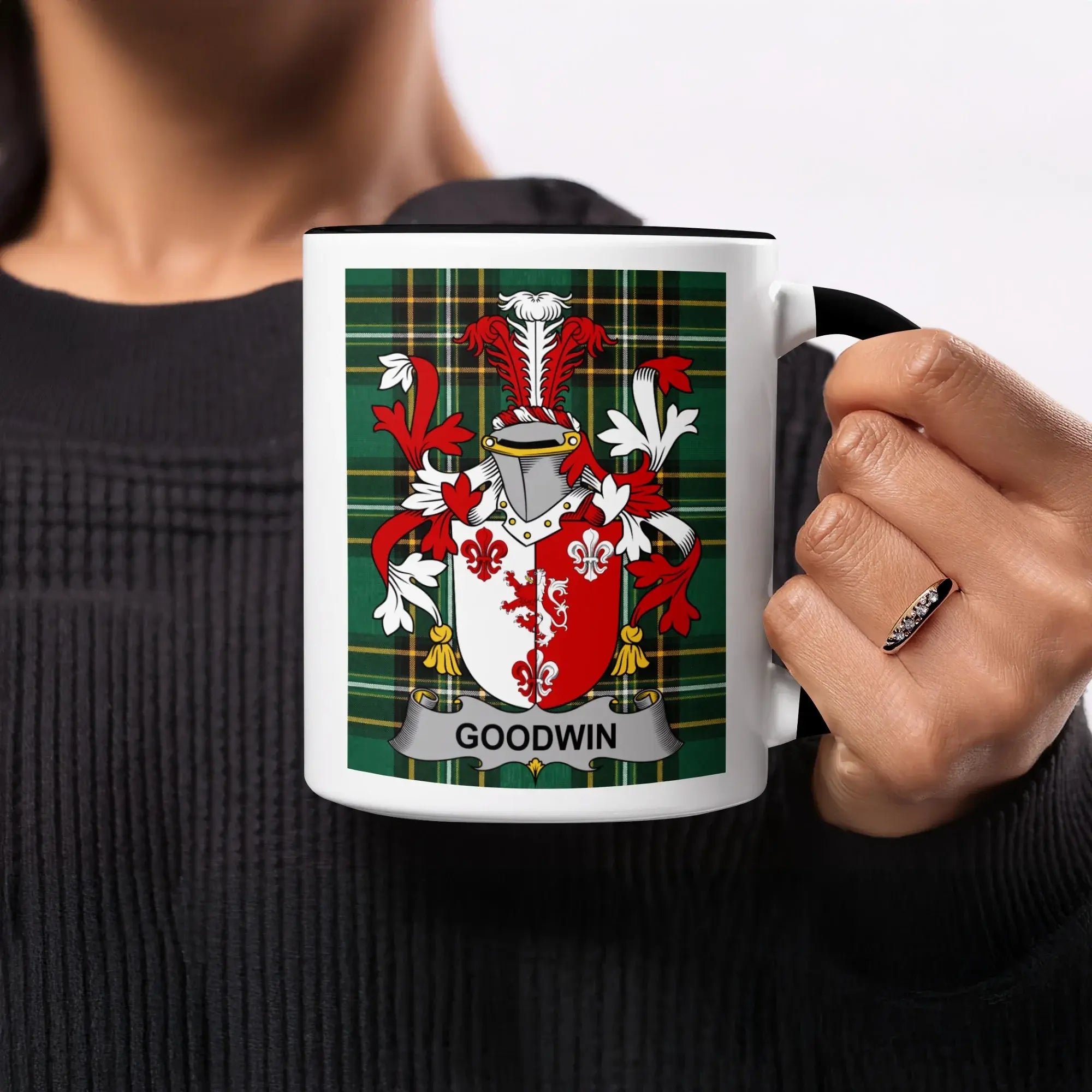 Mug featuring the Goodwin family crest on a tartan background.