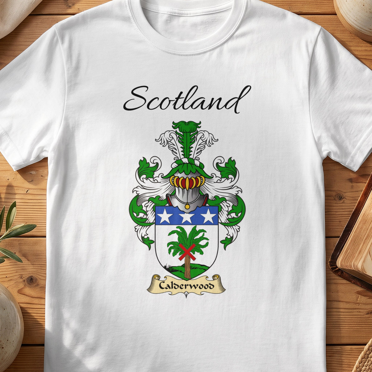 White Calderwood Scottish family shield T-shirt featuring a green tree beneath a blue band with white stars