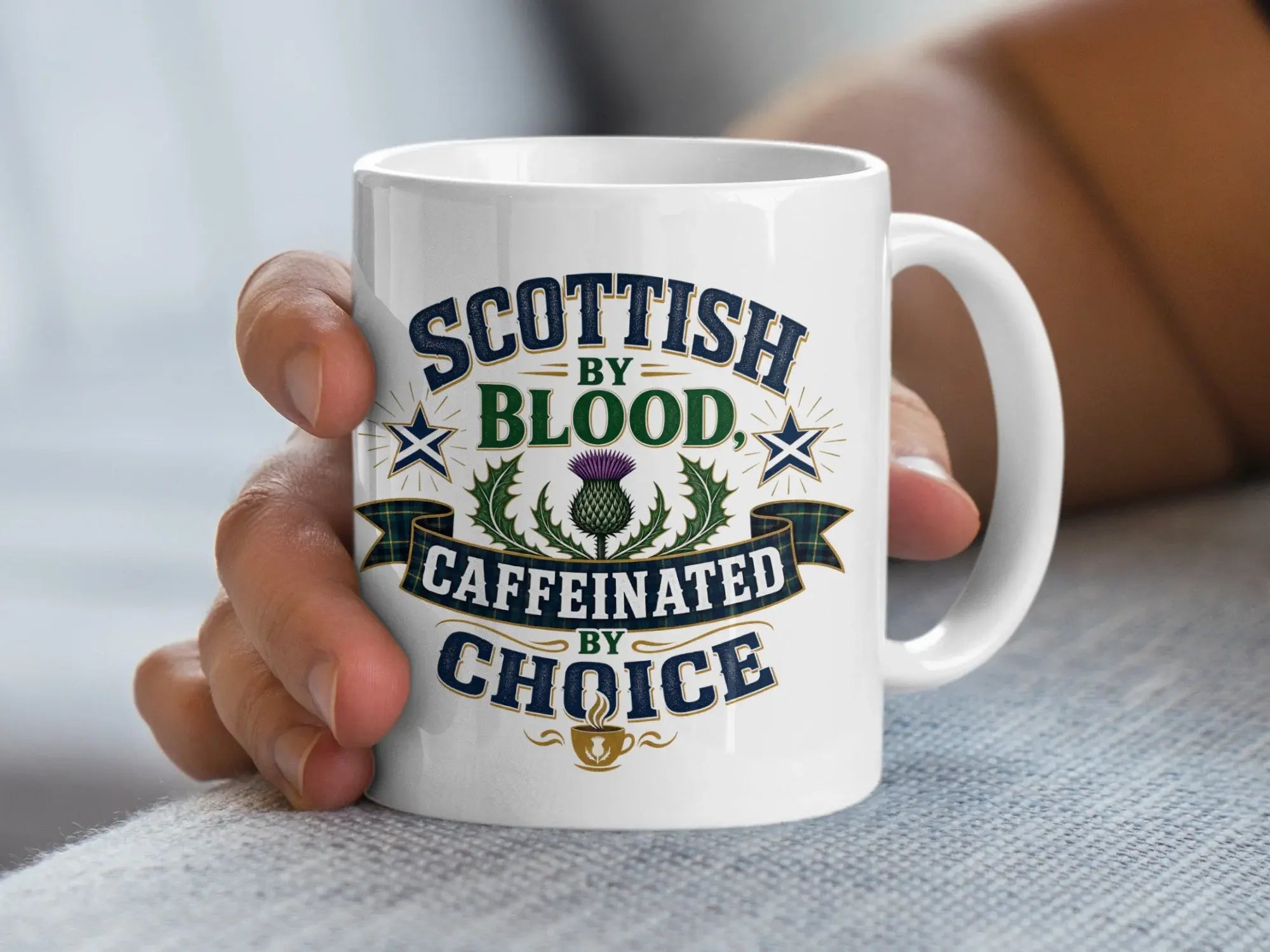 White mug with "Scottish by Blood Caffeinated by Choice" text and thistle design.