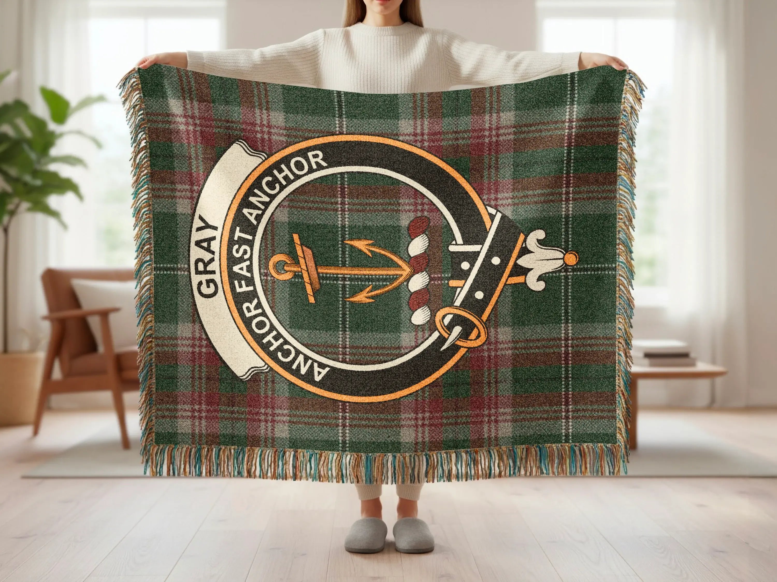 Gray Anchor Fast Anchor tartan plaid woven blanket draped — clan crest, fringe edges