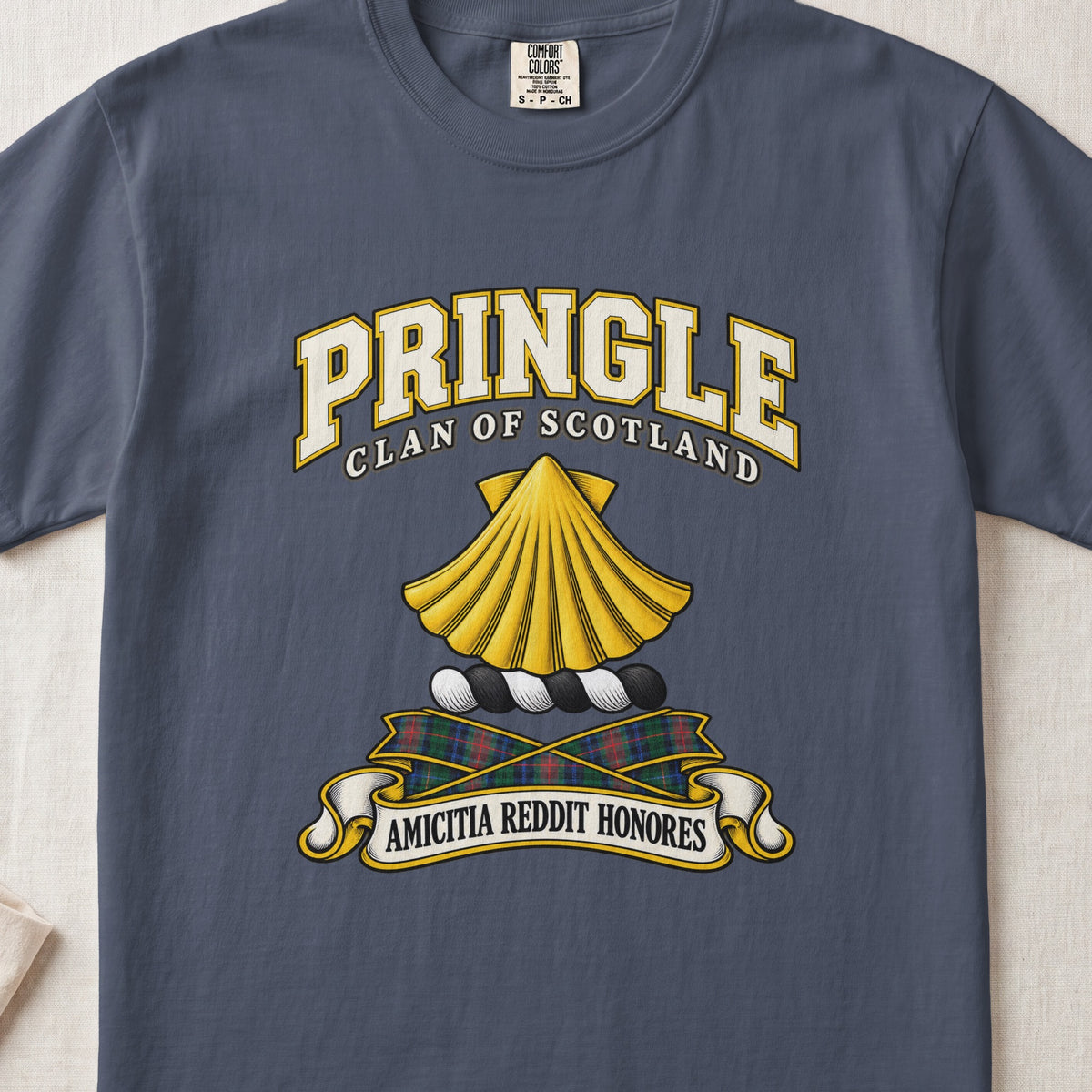 Pringle Scottish clan T-shirt in Midnight, front view with a golden scallop shell and motto design.
