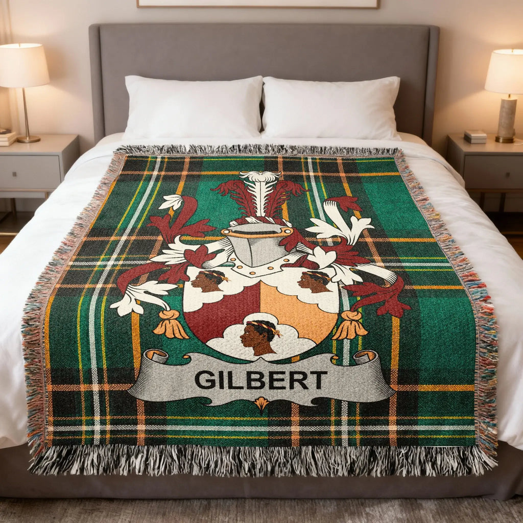 Tartan blanket with a coat of arms displaying the surname "Gilbert".