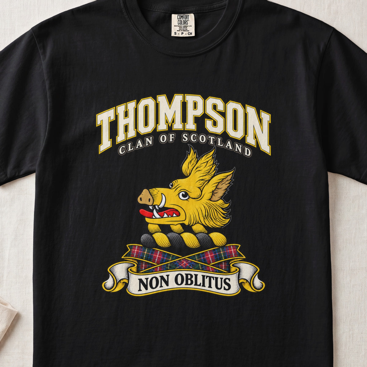 Thompson Scottish clan T-shirt in Black, front view with a golden boar head and motto banner.