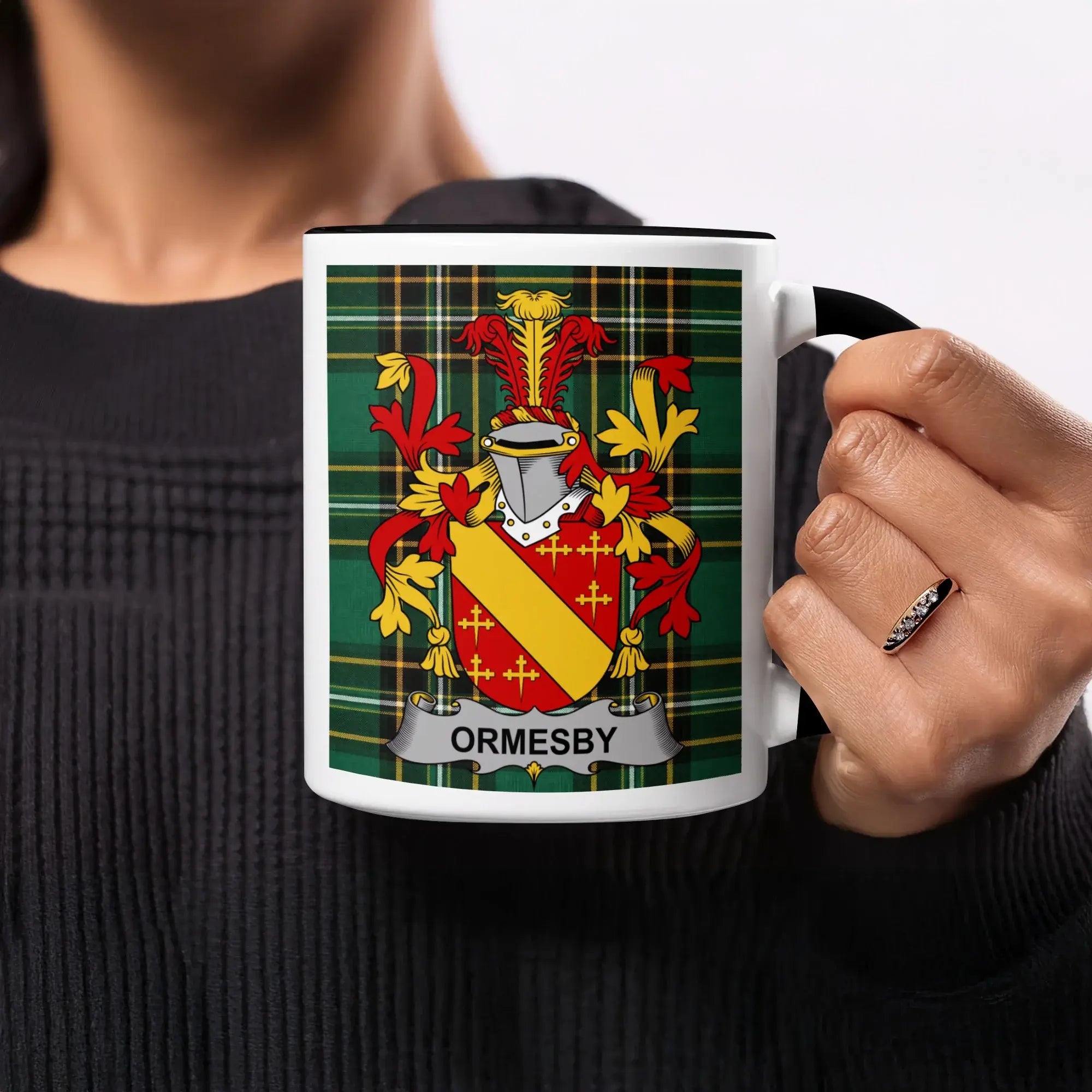 Mug with Ormsby family crest on tartan background.
