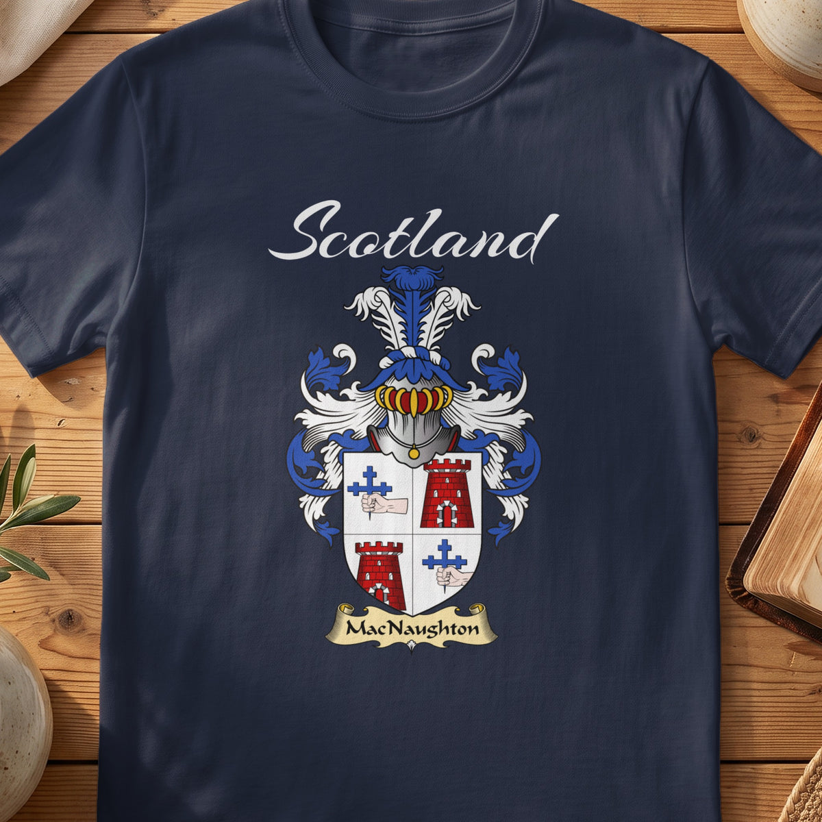Navy MacNaughton family shield T-shirt featuring a quartered shield with red towers and blue crosses