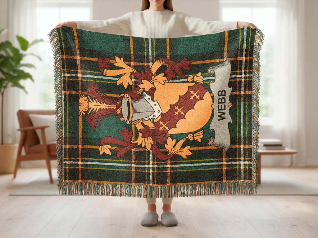 Plaid throw blanket with heraldic crest and "WEBB" text.