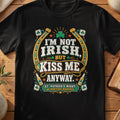 Black T-shirt with “I'm Not Irish, Kiss Me Anyway” St Patrick's Day graphic and shamrocks.