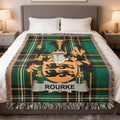 Green plaid blanket with Rourke family crest.
