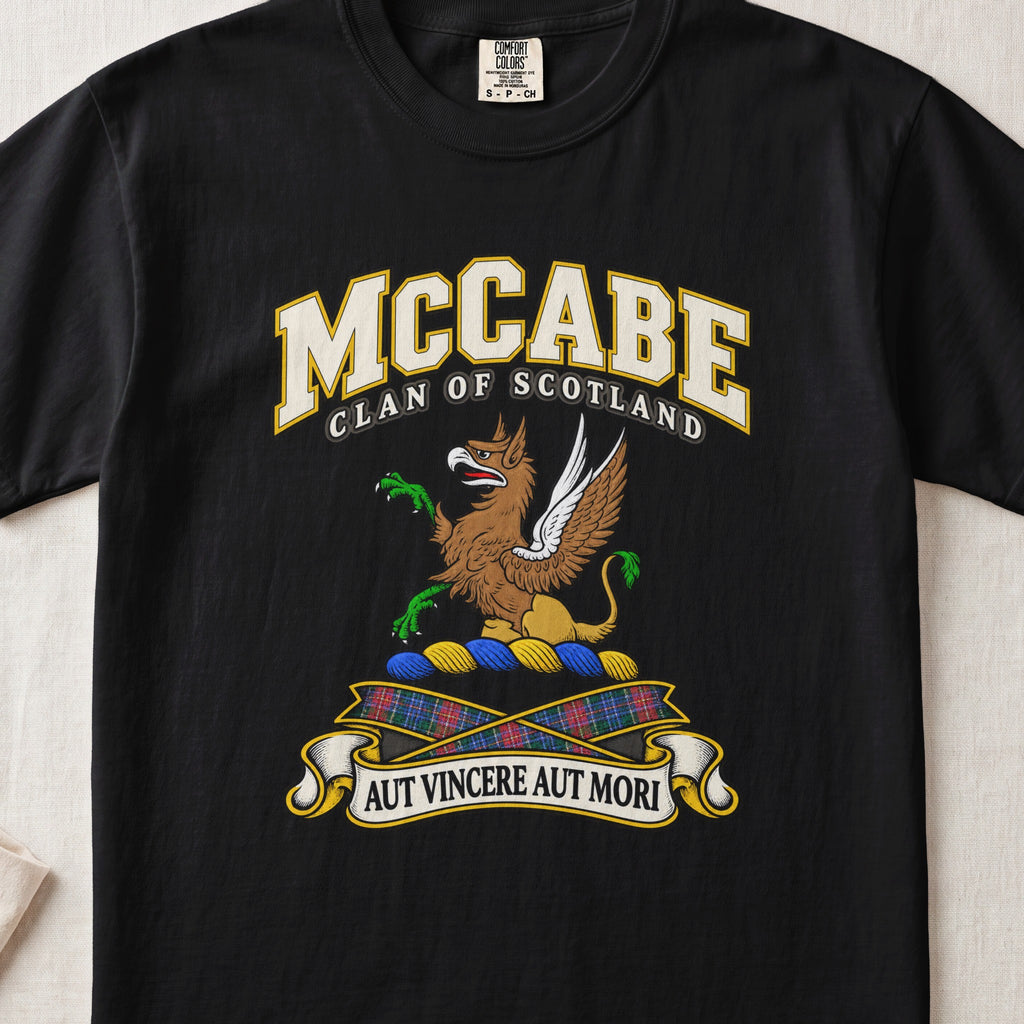 McCabe Scottish clan T-shirt in Black, front view with a brown and gold winged griffin with green claws and motto banner.