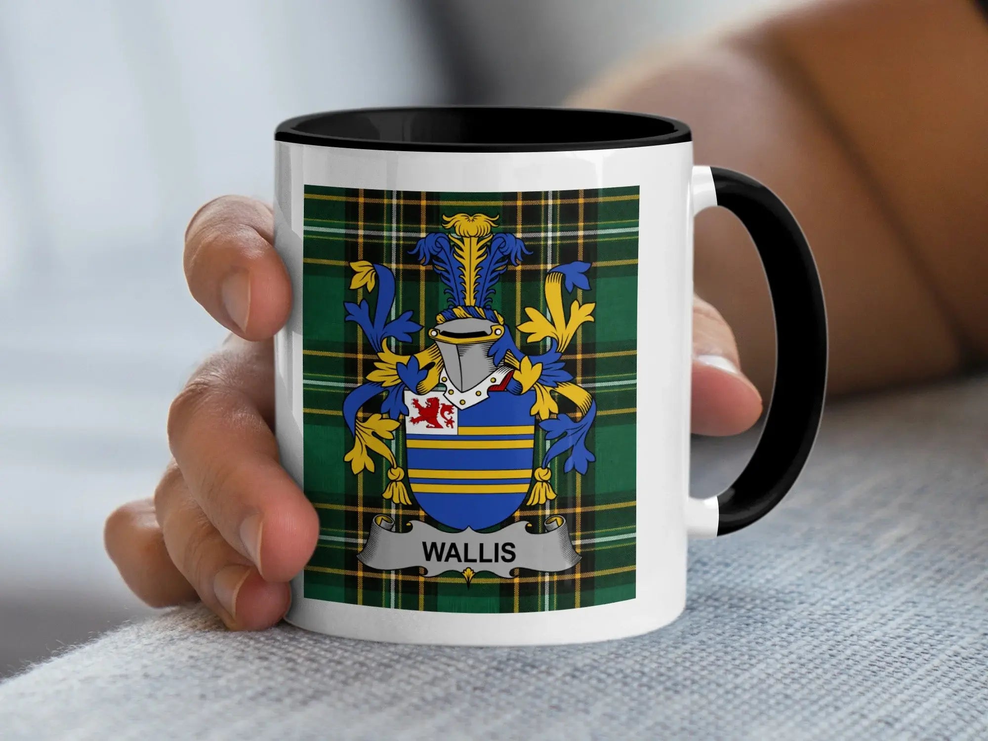 Mug with the Wallis family crest on a tartan background.